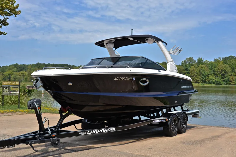 Slide: The Image of 2020 Chaparral 25 Surf boat on trailer at lakeside park. - 12