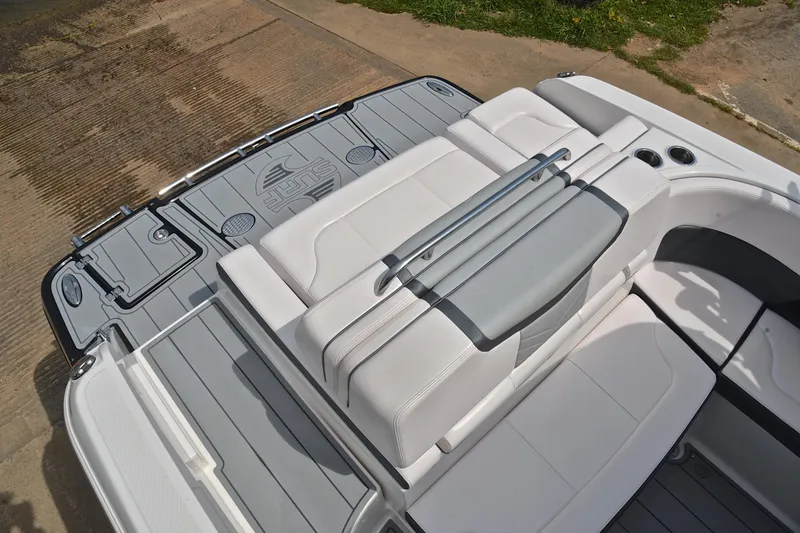 Slide: The Image of 2020 Chaparral 25 Surf boat interior with sleek seating and swim platform. - 25