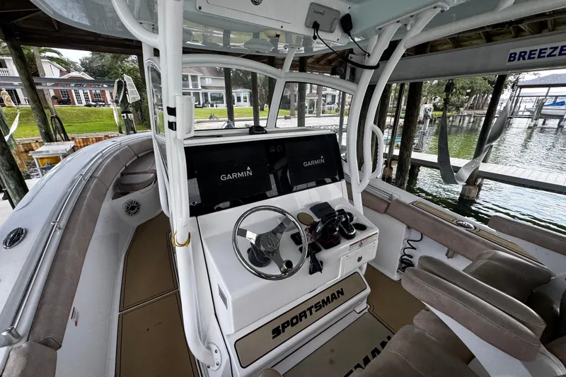 Slide: The Image of 2020 Sportsman Open 312 Center Console boat interior with Garmin navigation system. - 16