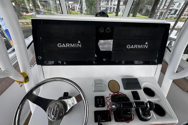 Slide: The Image of 2020 Sportsman Open 312 Center Console dashboard with Garmin navigation displays. - 17