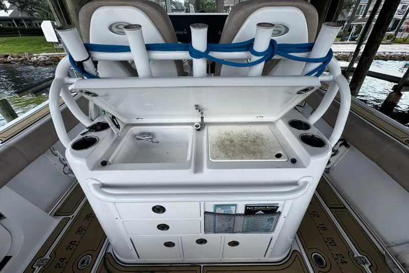 Slide: The Image of 2020 Sportsman Open 312 Center Console boat with fishing station and rod holders. - 21