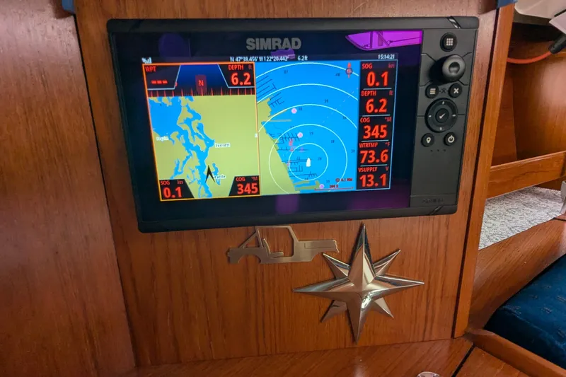 Slide: The Image of Simrad navigation display on 2002 Jeanneau Sun Odyssey 37 sailboat, showing map and data. - 19