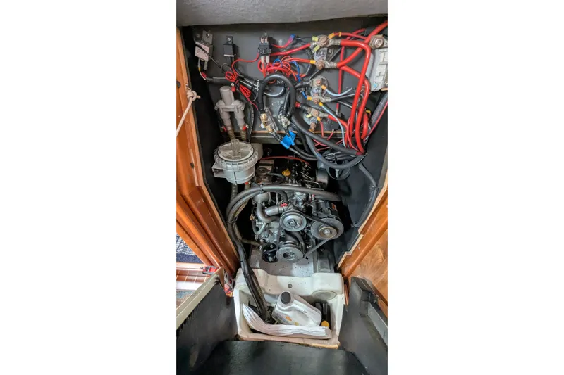 Slide: The Image of Engine compartment of a 2002 Jeanneau Sun Odyssey 37 sailboat, showing wiring and components. - 20