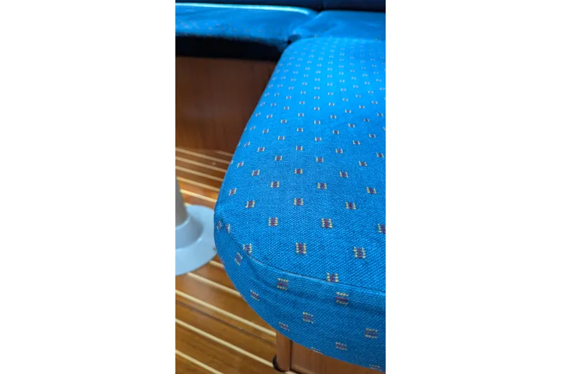 Slide: The Image of Blue patterned upholstery on Jeanneau Sun Odyssey 37 yacht, 2002 model, with wooden flooring. - 21