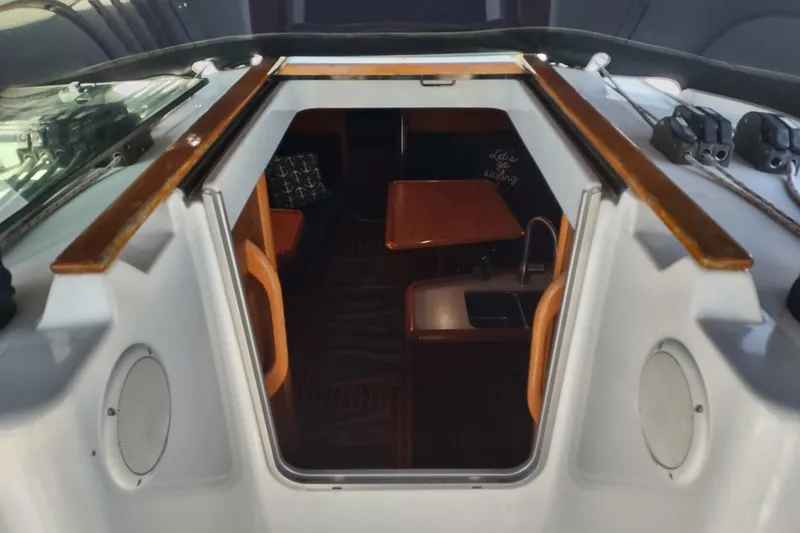 Slide: The Image of Interior view of 2002 Jeanneau Sun Odyssey 37 sailboat, featuring a cozy cabin space. - 8
