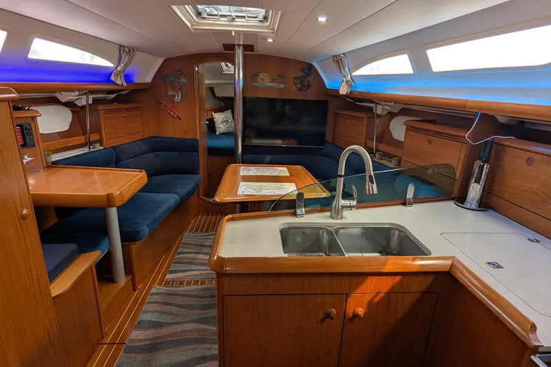 Slide: The Image of Interior of 2002 Jeanneau Sun Odyssey 37 sailboat with cozy seating and modern kitchen. - 9