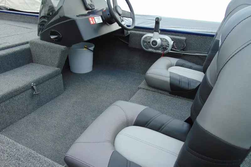 Slide: The Image of Interior of 2026 Crestliner 1700 Storm boat with gray seating and steering console. - 5