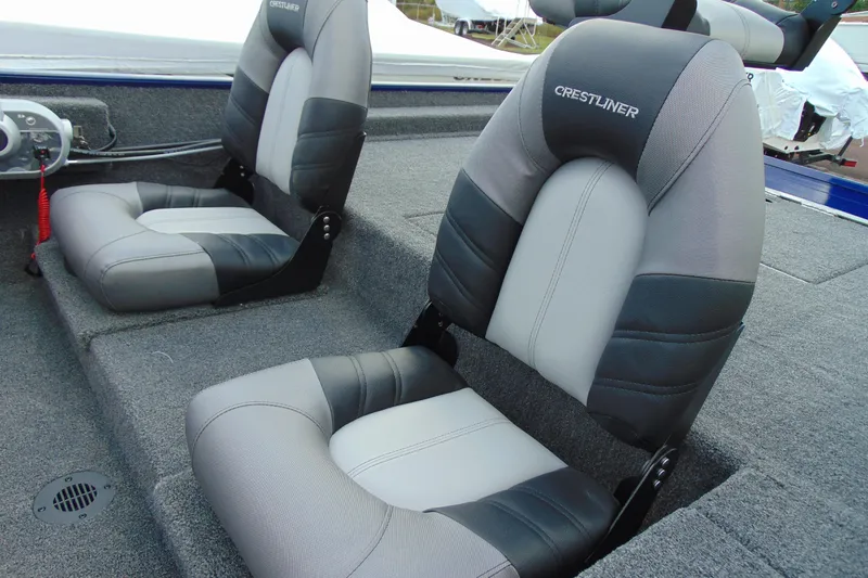 Slide: The Image of 2026 Crestliner 1700 Storm boat seats, featuring gray and black upholstery. - 6