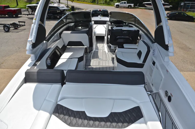 Slide: The Image of 2024 Monterey 305 Super Sport boat interior with luxurious seating and modern design. - 20