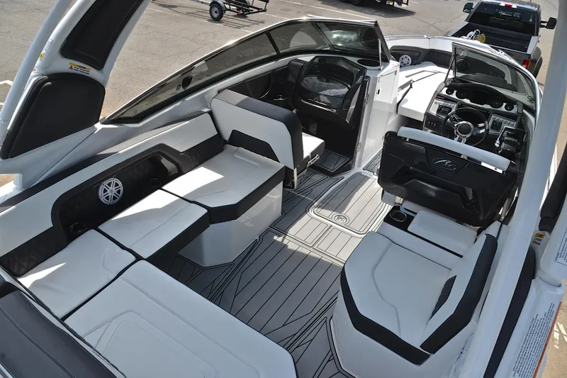 Slide: The Image of 2024 Monterey 305 Super Sport boat interior with sleek seating and modern dashboard design. - 21