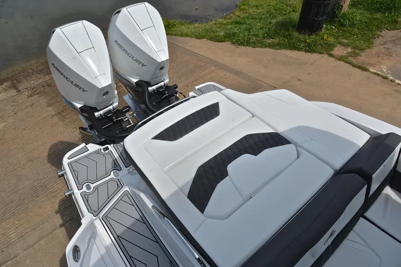 Slide: The Image of 2024 Monterey 305 Super Sport boat with dual Mercury outboard engines, rear seating view. - 26