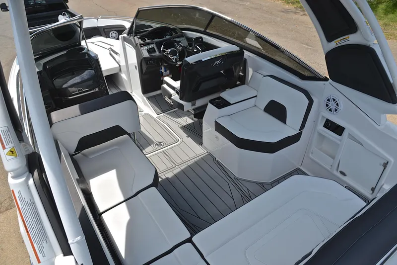 Slide: The Image of 2024 Monterey 305 Super Sport boat interior with sleek seating and modern dashboard design. - 27