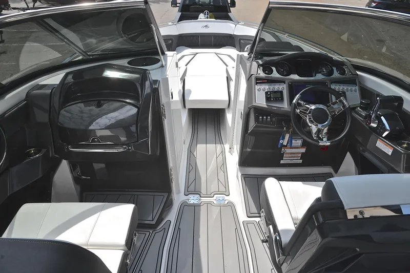 Slide: The Image of 2024 Monterey 305 Super Sport boat interior with modern dashboard and seating. - 28