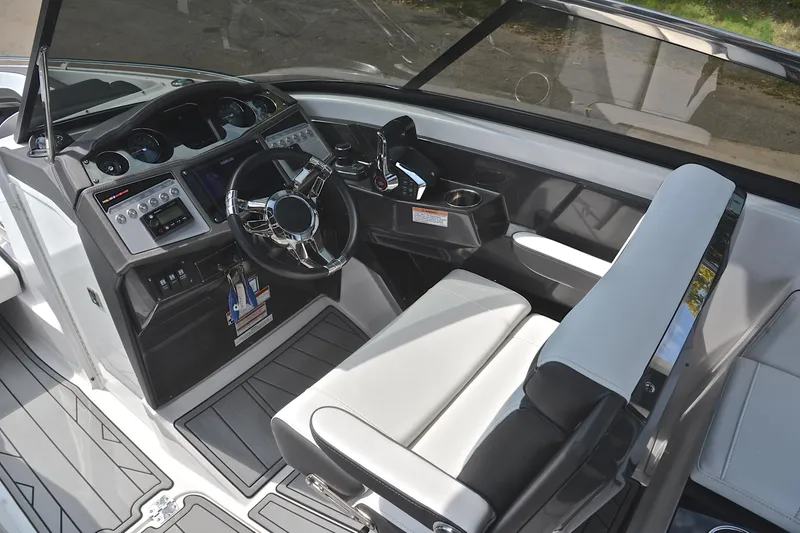 Slide: The Image of 2024 Monterey 305 Super Sport boat interior with modern dashboard and steering wheel. - 29