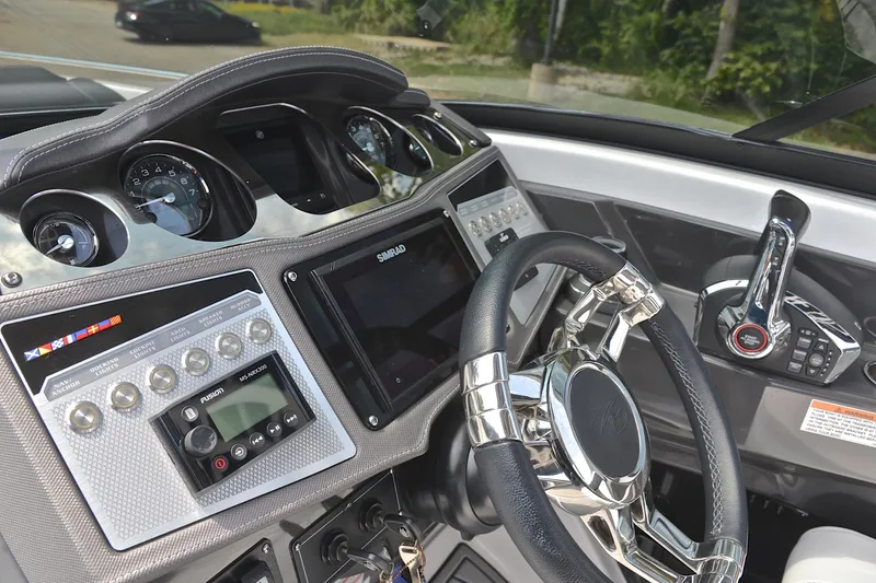 Slide: The Image of 2024 Monterey 305 Super Sport dashboard with advanced controls and steering wheel. - 31