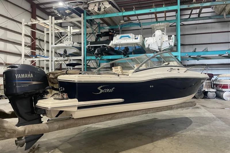 Slide: The Image of 2008 Scout 242 Dorado boat with Yamaha engine in indoor storage facility. - 0