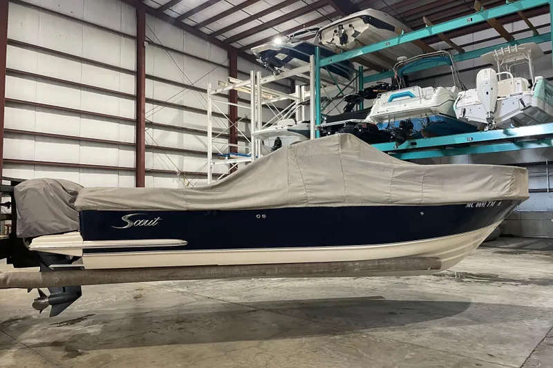 Slide: The Image of Covered 2008 Scout 242 Dorado boat in indoor storage facility. - 5