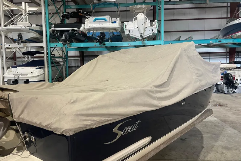 Slide: The Image of Covered 2008 Scout 242 Dorado boat in indoor storage facility. - 6