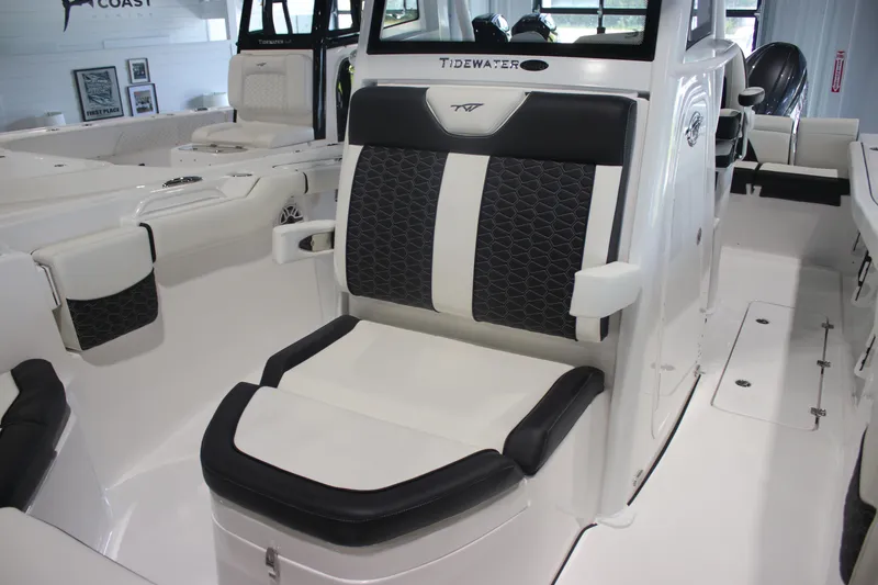 Slide: The Image of 2026 Tidewater 256 LXF boat interior with stylish seating and modern design. - 20
