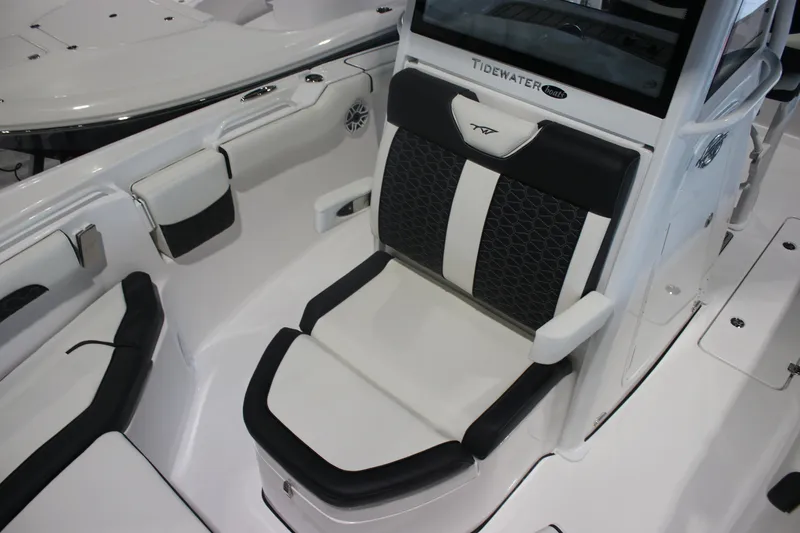 Slide: The Image of 2026 Tidewater 256 LXF boat interior with stylish seating and modern design. - 7