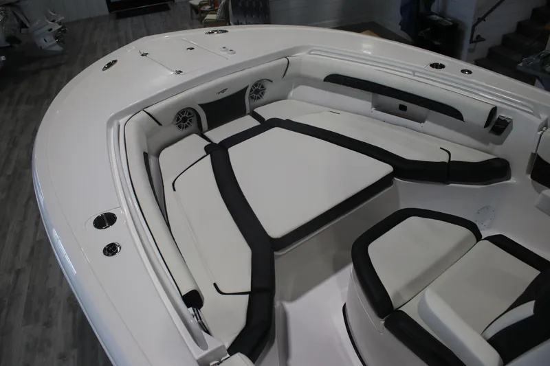 Slide: The Image of 2026 Tidewater 256 LXF boat interior with cushioned seating and modern design. - 8