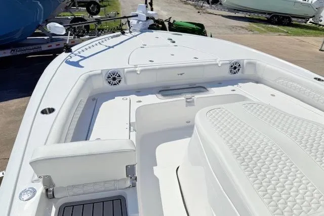 Slide: The Image of 2026 Tidewater 3100 Carolina Bay boat interior with white seating and deck details. - 11