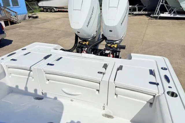 Slide: The Image of 2026 Tidewater 3100 Carolina Bay boat with dual Mercury outboard engines. - 6