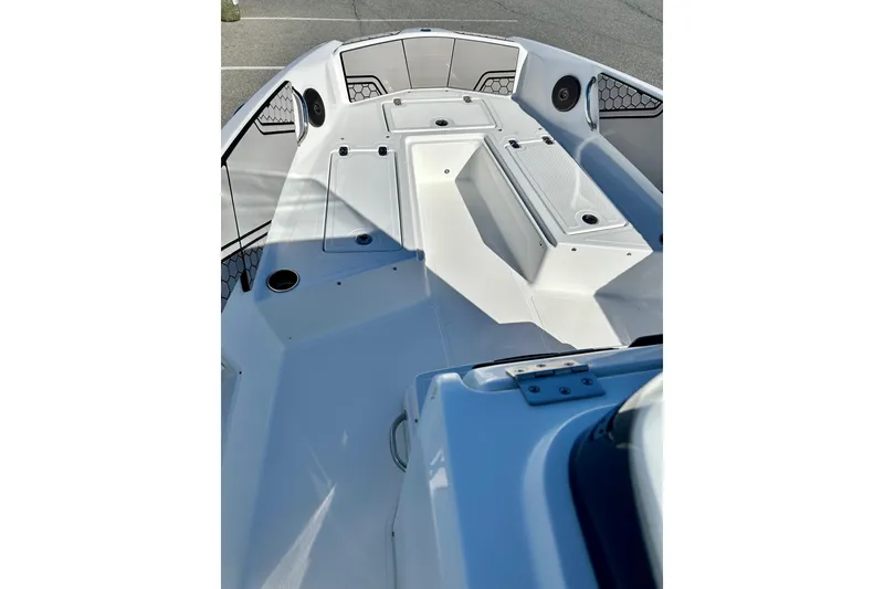 Slide: The Image of 2021 Scarab 195 ID boat interior with seating and storage compartments. - 12
