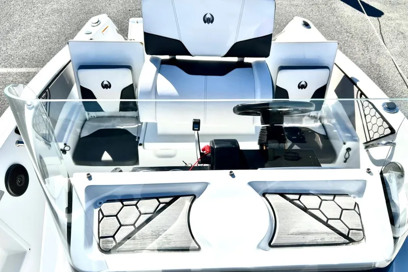Slide: The Image of 2021 Scarab 195 ID boat interior with modern dashboard and seating design. - 19