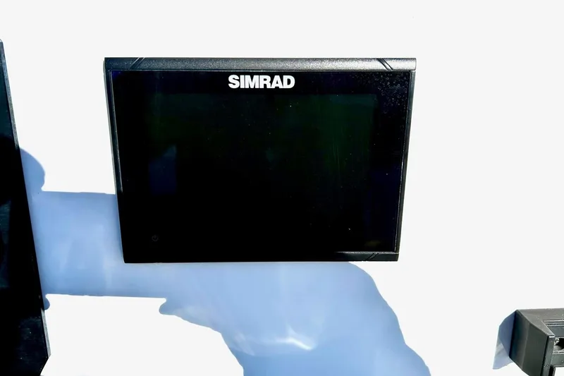 Slide: The Image of Simrad display on 2021 Scarab 195 ID boat dashboard, close-up view. - 25