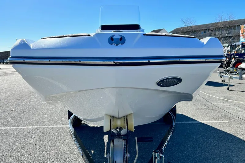 Slide: The Image of 2021 Scarab 195 ID boat on trailer, front view in outdoor setting. - 4