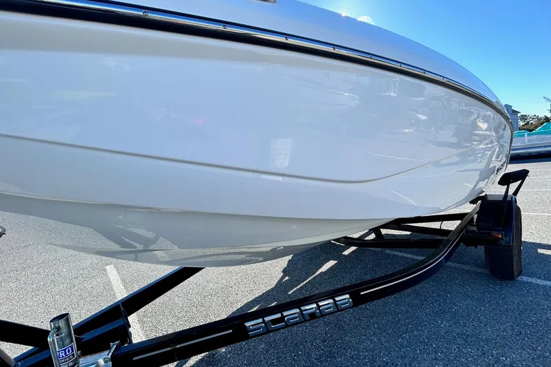 Slide: The Image of 2021 Scarab 195 ID boat on trailer, close-up view of hull. - 7