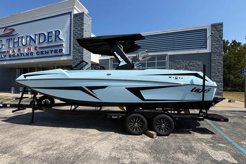 The Image of 2026 Tigé 24RZX boat on trailer at Big Thunder Marine dealership. - 1