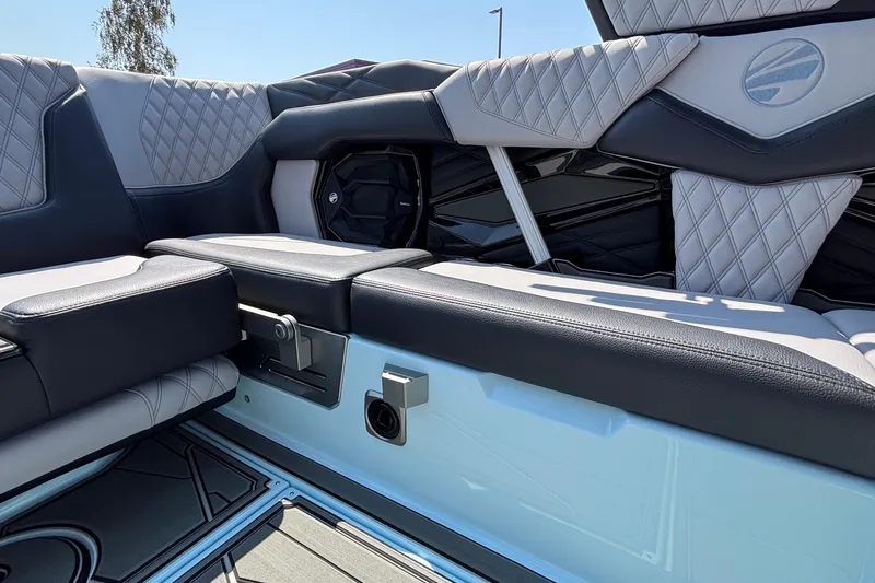 Slide: The Image of 2026 Tigé 24RZX boat interior with luxurious quilted seating and modern design. - 18