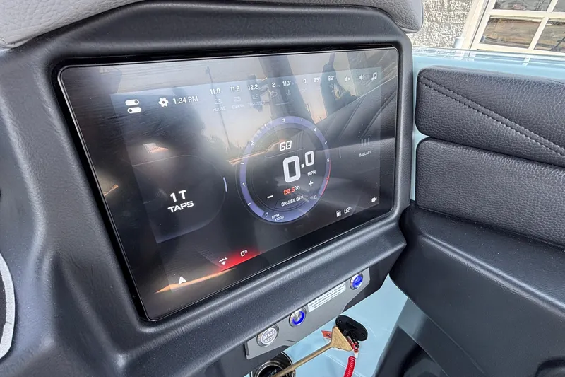 Slide: The Image of Touchscreen dashboard of a 2026 Tigé 24RZX boat displaying speed and controls. - 24