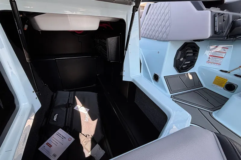 Slide: The Image of 2026 Tigé 24RZX interior storage and seating area with modern design features. - 32