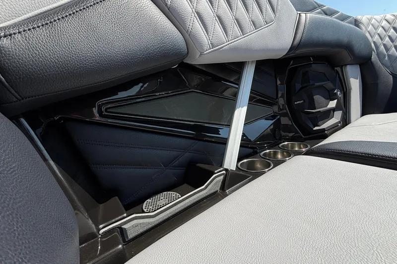 Slide: The Image of 2026 Tigé 24RZX interior with premium seating, cup holders, and speaker system. - 57