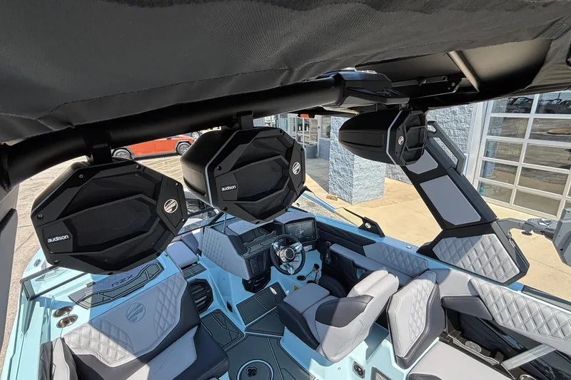 Slide: The Image of 2026 Tigé 24RZX boat interior with premium audio system and modern seating design. - 61