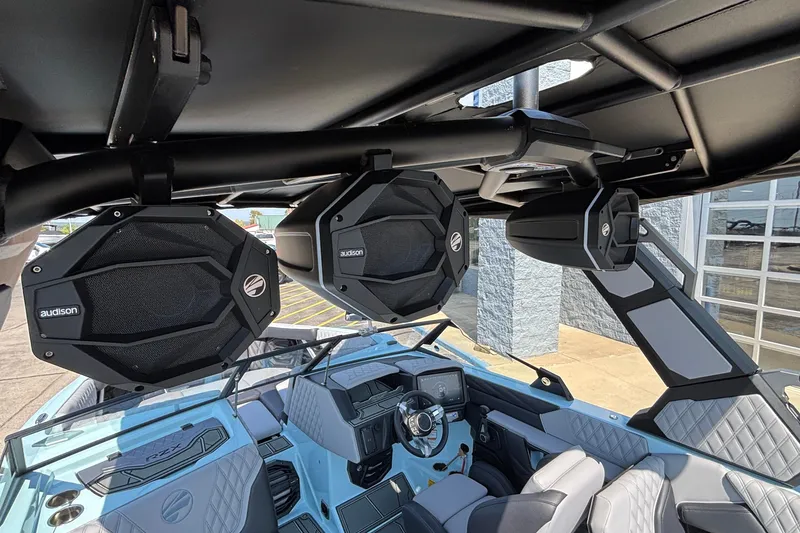 Slide: The Image of 2026 Tigé 24RZX boat interior with premium Audison speakers and modern dashboard design. - 62