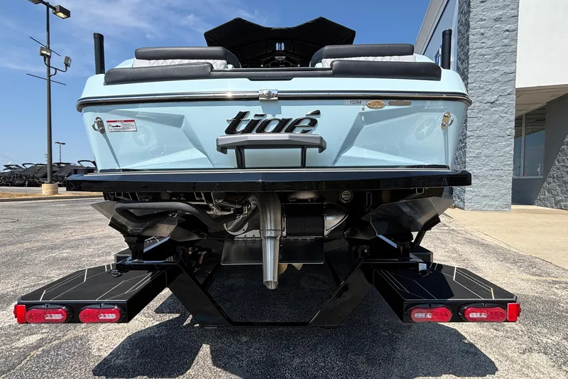 Slide: The Image of 2026 Tigé 24RZX boat rear view, showcasing sleek design and dual swim platforms. - 8