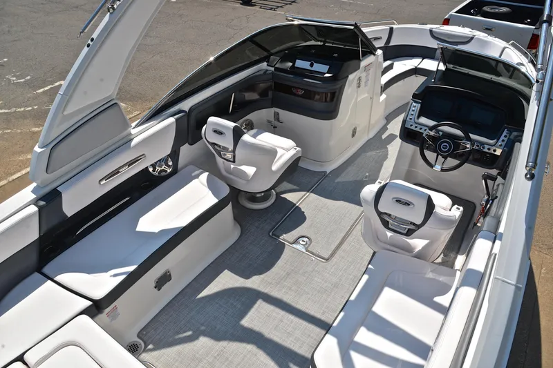 Slide: The Image of 2019 Chaparral 277 SSX boat interior with sleek seating and modern dashboard design. - 21