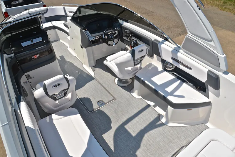 Slide: The Image of 2019 Chaparral 277 SSX boat interior with modern seating and sleek dashboard design. - 25