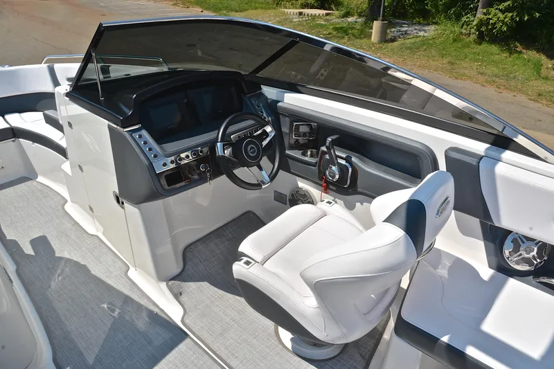 Slide: The Image of 2019 Chaparral 277 SSX boat cockpit with modern steering and controls. - 26