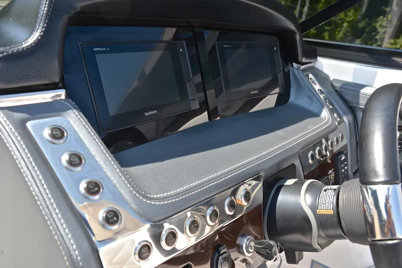 Slide: The Image of Dashboard of 2019 Chaparral 277 SSX boat with Garmin displays and controls. - 28