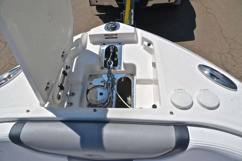 Slide: The Image of 2019 Chaparral 277 SSX boat anchor compartment with open hatch and visible chain. - 30
