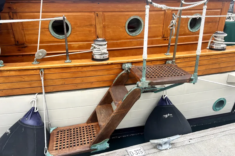 Slide: The Image of Vintage 1934 Pankey Schooner with wooden steps and nautical details. - 24