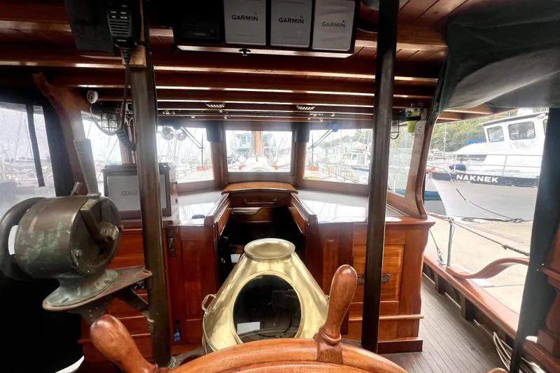 Slide: The Image of Interior view of a 1934 Pankey Schooner with wooden details and navigation equipment. - 26