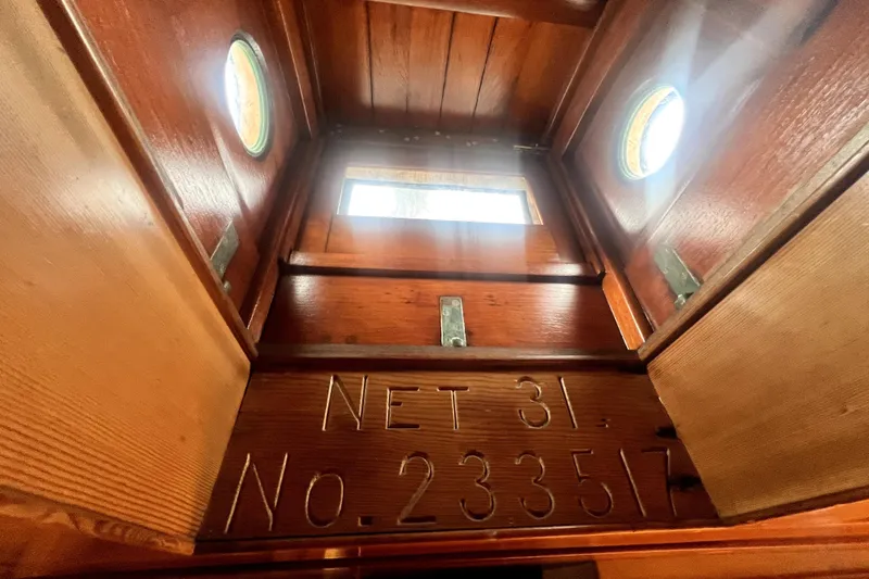 Slide: The Image of Interior view of 1934 Pankey Schooner with wooden details and portholes. - 51