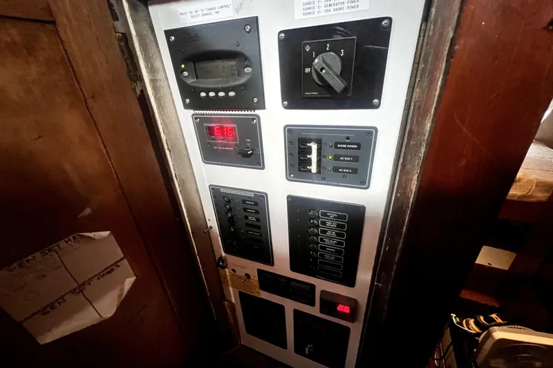 Slide: The Image of Electrical control panel inside a 1934 Pankey Schooner, featuring various switches and displays. - 57