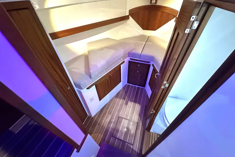 Slide: The Image of Luxurious interior of 2026 Ocean Sport 33 Cummins Shaft Drive boat cabin. - 10